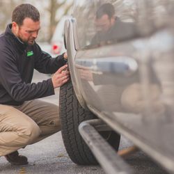 McCart's Auto Center - Kelly doing a tire inspection