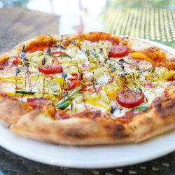 Ironstone Gold Leaf Bistro - Veggie Delight Pizza: Tomato, Artichoke Hearts, Bell Peppers, Mozzarella, Pesto