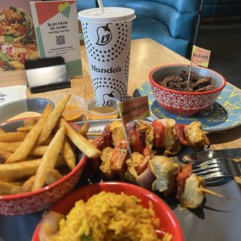 Nando's Peri-Peri - Chicken Thigh Skewers, PERi Chips (aka Fries), Portuguese Rice, Livers - Chicken Shop Near Me - Washington, DC, District of Columbia Nando's Peri-Peri - Chicken Thigh Skewers, PERi Chips (aka Fries), Portuguese Rice, Livers - Chicken Shop Near Me - Washington, DC, District of Columbia