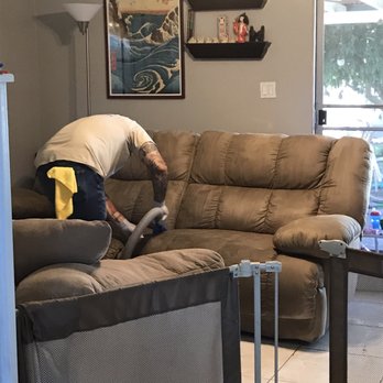 Mendoza's Cleaner Concepts - Miguel working hard on our couches. - Carpet Cleaning Near Me