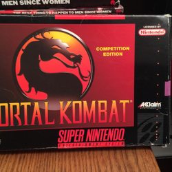 Game Portal - Mortal Kombat on SNES is ultra-censored but it came in its original packaging so I had to have it. Good times!