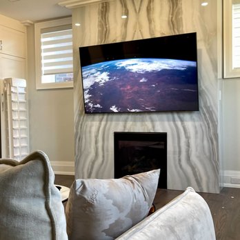 Auxe - Television installed above fireplace; tile wall - TV Mounting Near Me Auxe - Television installed above fireplace; tile wall - TV Mounting Near Me
