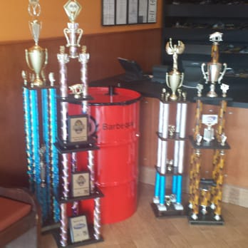 Q Barbeque - Trophies at the entrance. - Barbeque Near Me - Glen Allen, Virginia