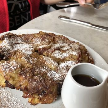 Mioposto - PANENATA Mio Bread soaked in egg custard oven roasted in a skillet with apples & pancetta, finished with cinnamon & sugar - Italian Near Me - Seattle, Washington Mioposto - PANENATA Mio Bread soaked in egg custard oven roasted in a skillet with apples & pancetta, finished with cinnamon & sugar - Italian Near Me - Seattle, Washington