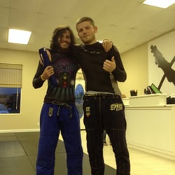 10th Planet Jiu Jitsu Gulf Shores - Derek Overby getting his blue belt from head jiu jitsu instructor, Sean Applegate.