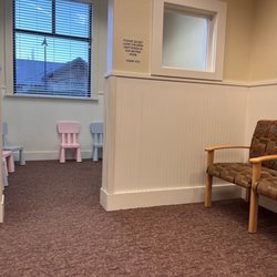Alpine Pediatrics - Waiting room with small chairs for kids & a tv