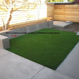 Artificial Lawns Direct scratched our newly poured wall with their vibrating plate compactor during their botched installation Artificial Lawns Direct scratched our newly poured wall with their vibrating plate compactor during their botched installation