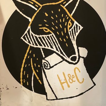 Hatch & Coop - a fox holding a sign - New American Near Me - Philadelphia, Pennsylvania