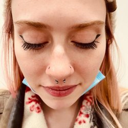 Almost Famous Body Piercing - Nose piercings on both sides of the nose and a septum piercing. Almost Famous Body Piercing in Mankato, Minnesota