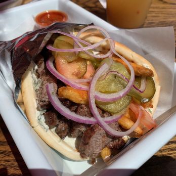Mazra - Street Wrap with Lamb Kebab, Fries, Tzatziki Sauce, Tomato, Pickles, Onion, and Hot Sauce - Mediterranean Near Me - San Bruno, California Mazra - Street Wrap with Lamb Kebab, Fries, Tzatziki Sauce, Tomato, Pickles, Onion, and Hot Sauce - Mediterranean Near Me - San Bruno, California