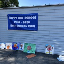 Art work and the Happy Day School sign