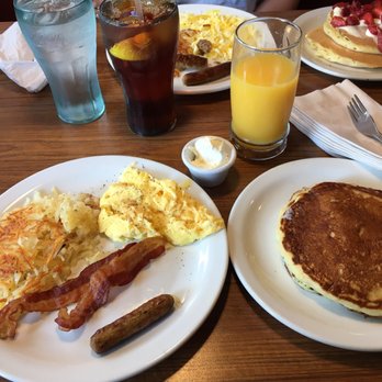 Denny's - Grand Slam Slugger with OJ! Strawberry Pancakes in the back right of picture. Great meal! - Diners Near Me - Saint Louis, Missouri