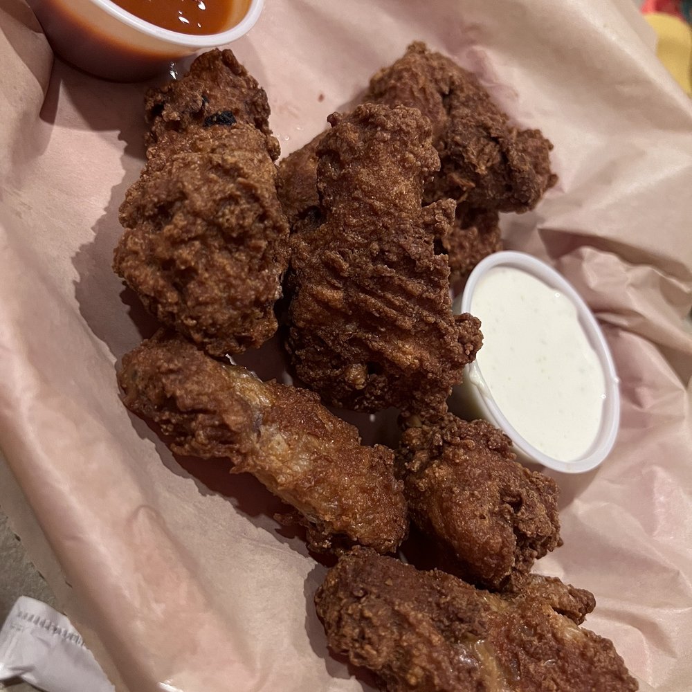Fried Buffalo wings...the sauce is fried into the batter...we asked for sauce on the side but we really didn't need it.