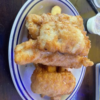 Barbara's Fishtrap - 4 pieces of fish cover the huge French fries! - Seafood Near Me - Half Moon Bay, California Barbara's Fishtrap - 4 pieces of fish cover the huge French fries! - Seafood Near Me - Half Moon Bay, California