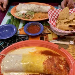 Chiefs Burrito!! Beef burrito with rice, beans, avocado, & sour cream, smothered w/queso blanco, yellow queso, & red sauce! Go chiefs