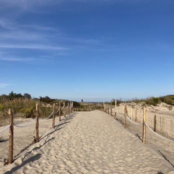 Cape Henlopen State Park - The long sandy path from the Atlantic Ocean beach back to the parking lot. Harbor of Refuge East End Lighthouse in the distance. - Parks Near Me - Lewes, Delaware Cape Henlopen State Park - The long sandy path from the Atlantic Ocean beach back to the parking lot. Harbor of Refuge East End Lighthouse in the distance. - Parks Near Me - Lewes, Delaware
