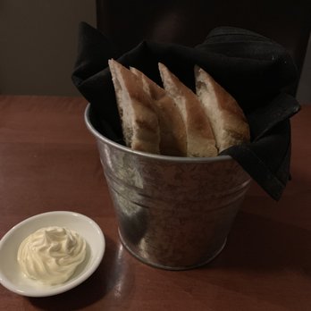 Rare Grill House - a bucket of pita bread and a small bowl of sour cream - Steakhouses Near Me - Peterborough, Ontario Rare Grill House - a bucket of pita bread and a small bowl of sour cream - Steakhouses Near Me - Peterborough, Ontario