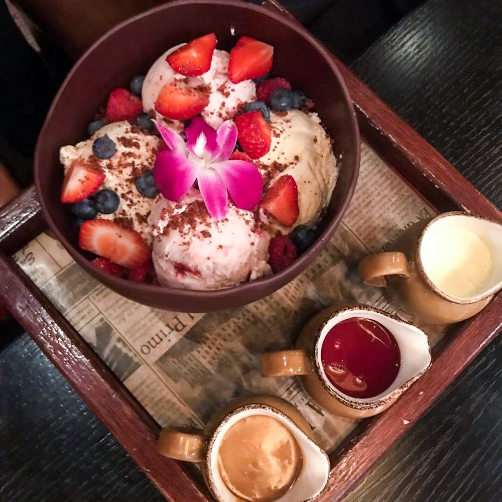 Toro Toro - La Bomba- chocolate sphere, cream cheese mousse, dulce de leche, strawberry ice cream, fresh berries, almond cookie crumbs, caramel, vanilla - Steakhouses Near Me - Miami, Florida