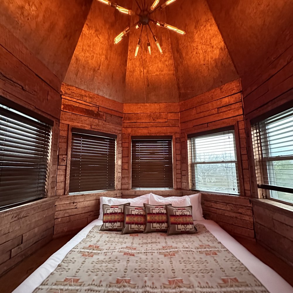 a bed in a rustic bedroom a bed in a rustic bedroom