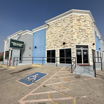 Wingstop - the outside of a building with a parking space - Chicken Wings Near Me - South Padre Island, Texas