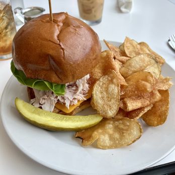 CAM Café - Turkey club on bun instead of croissant with chips - Cafes Near Me - Wilmington, North Carolina CAM Café - Turkey club on bun instead of croissant with chips - Cafes Near Me - Wilmington, North Carolina
