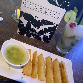 Gandules Grill - Yuca bites w/ garlic sauce - Puerto Rican Near Me - Lehigh Acres, Florida Gandules Grill - Yuca bites w/ garlic sauce - Puerto Rican Near Me - Lehigh Acres, Florida