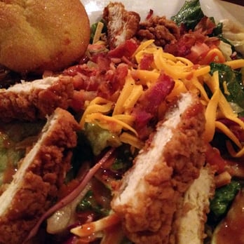 Famous Daves - "Sassy Dave's Barbeque Salad," topped with crispy chicken, bacon, Cheddar, shoestring potatoes and honey BBQ dressing. - Barbeque Near Me - Long Beach, California Famous Daves - "Sassy Dave's Barbeque Salad," topped with crispy chicken, bacon, Cheddar, shoestring potatoes and honey BBQ dressing. - Barbeque Near Me - Long Beach, California