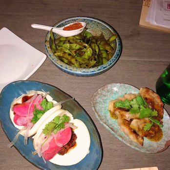 Lucky Robot Restaurant - Spicy edamame (top) steamed pork buns (left) dumplings (right) - Sushi Bars Near Me - Austin, Texas Lucky Robot Restaurant - Spicy edamame (top) steamed pork buns (left) dumplings (right) - Sushi Bars Near Me - Austin, Texas