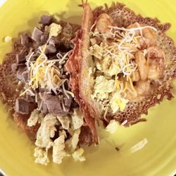 Keto carnivore Tacos tortilla is made out of crunchy cheese, scrambled eggs your choice of protein topping and shredded cheese.