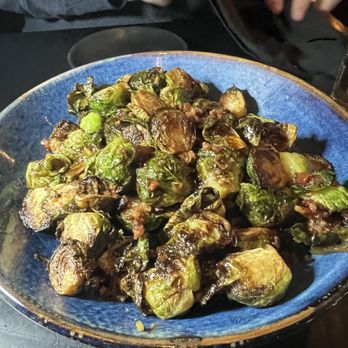 Curtain Call Lounge - Brussels Sprouts with applewood smoked bacon, caramelized onion, and local honey. - Wine Bars Near Me - Saint Louis, Missouri Curtain Call Lounge - Brussels Sprouts with applewood smoked bacon, caramelized onion, and local honey. - Wine Bars Near Me - Saint Louis, Missouri