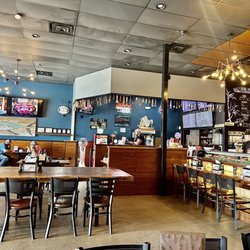 Bamboo's layout, natural light from windows combined with industrial chandeliers. Laid back but still fancy.