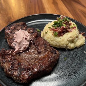 Crave Kitchen & Bar - Snake river farms ribeye with loaded mashed potatoes - Bars Near Me - Eagle, Idaho