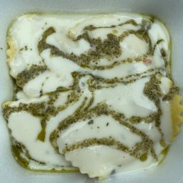 Tasteless Cheese Ravioli with "Creamy Basil Sauce" (i.e. flavorless Alfredo drizzled with basil oil)