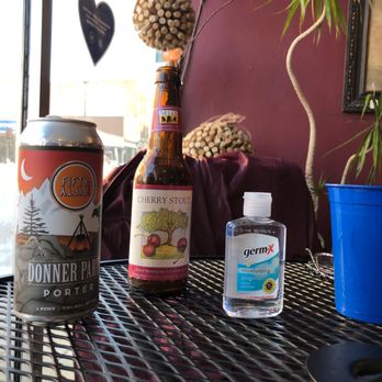 Uncorkt - a bottle of beer, a can of beer, and a blue cup on a table - Wine Bars Near Me - Racine, Wisconsin Uncorkt - a bottle of beer, a can of beer, and a blue cup on a table - Wine Bars Near Me - Racine, Wisconsin