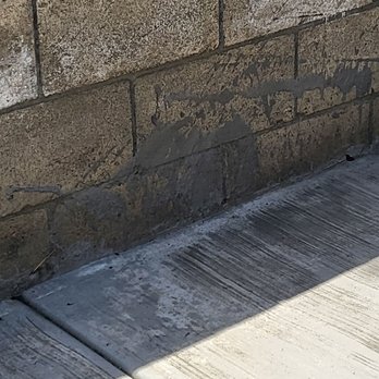 San Diego Paverscape - Splashes of Cement from the patio onto the retaining wall. - Landscaping Near Me San Diego Paverscape - Splashes of Cement from the patio onto the retaining wall. - Landscaping Near Me