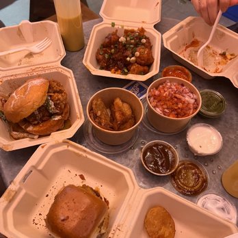 Rowdy Rooster - (Center top clockwise) Chili Cauliflower, Green Chickpea Chaat, vada pao, big rowdy, potato pakora (middle) - Indian Near Me - New York, New York