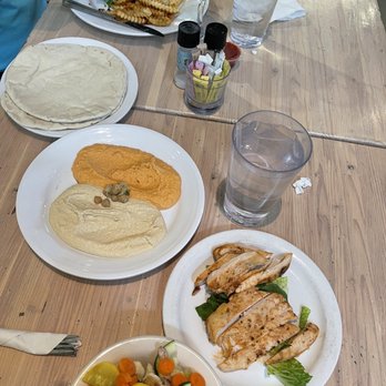 Pita Jungle - The spread: Chipotle Black Bean Burger, hummus duo, side of Chicken Breast, and side of Mixed Veggies. - New American Near Me - Phoenix, Arizona