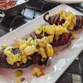 Agave - Bacon-wrapped stuffed jalapenos, topped with pineapple - Cocktail Bars Near Me - Seattle, Washington Agave - Bacon-wrapped stuffed jalapenos, topped with pineapple - Cocktail Bars Near Me - Seattle, Washington