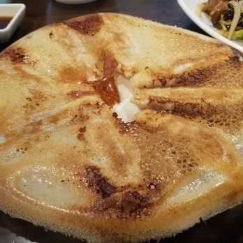 LanZhou Ramen - Pan-fried pork dumplings (the top is the crepe-thin crust under which waits the delicious dumplings) - Chinese Near Me - Doraville, Georgia LanZhou Ramen - Pan-fried pork dumplings (the top is the crepe-thin crust under which waits the delicious dumplings) - Chinese Near Me - Doraville, Georgia