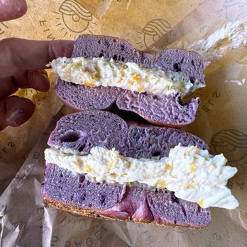 Fin's Bagels - Midsection of the blueberry bagel with peach and ginger cream cheese - Bagels Near Me - Honolulu, Hawaii Fin's Bagels - Midsection of the blueberry bagel with peach and ginger cream cheese - Bagels Near Me - Honolulu, Hawaii
