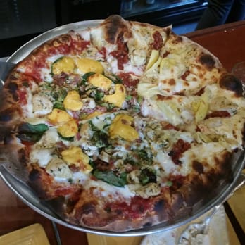 Wild Tomato - Half Green and Gold pizza, half chicken and choke - Pizza Near Me - Fish Creek, Wisconsin