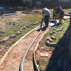 FM Concrete Solutions - Pouring concrete for a backyard walkway/patio to prepare for a stamped concrete