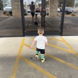 Mini Texans - Waylon running into school on St Pattys day