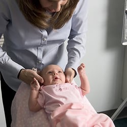 Highland Chiropractic Family Care - Dr Arlene checking an infant with gentle and safe chiropractic care.