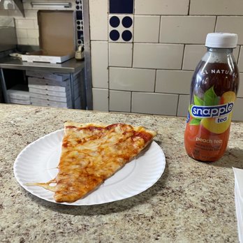 Brother’s Pizzeria - Classic Cheese Pizza Slice & peach Snapple - Pizza Near Me - Fresh Meadows, New York Brother’s Pizzeria - Classic Cheese Pizza Slice & peach Snapple - Pizza Near Me - Fresh Meadows, New York
