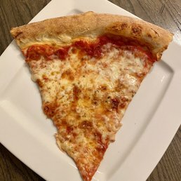 a slice of pizza on a plate a slice of pizza on a plate