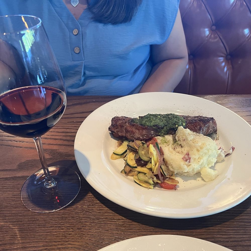 Amaro’s Table - New York with chimichurri, mashed potatoes and vegetable medley - New American Near Me - Castle Rock, Washington