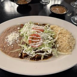 Enmolada entree with rice and beans Enmolada entree with rice and beans