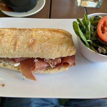 French Cafe - La Boulangerie - Prosciutto and goat cheese sandwich with a side salad. - French Near Me - Orlando, Florida French Cafe - La Boulangerie - Prosciutto and goat cheese sandwich with a side salad. - French Near Me - Orlando, Florida