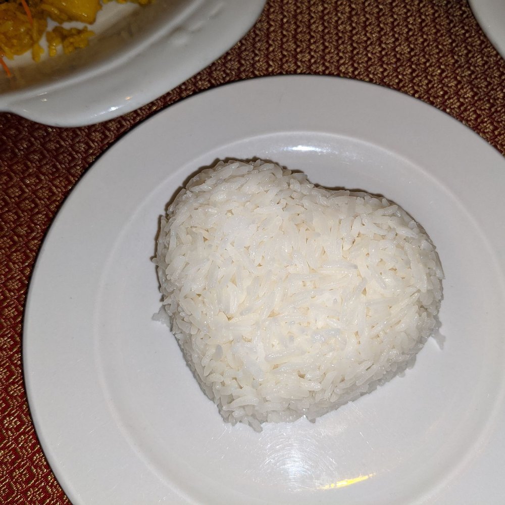 Ploy Thai - The waiter heard it was our anniversary and he can't see good in the photo but made us heart-shaped rice when they served us - Thai Near Me - Brandon, Florida Ploy Thai - The waiter heard it was our anniversary and he can't see good in the photo but made us heart-shaped rice when they served us - Thai Near Me - Brandon, Florida